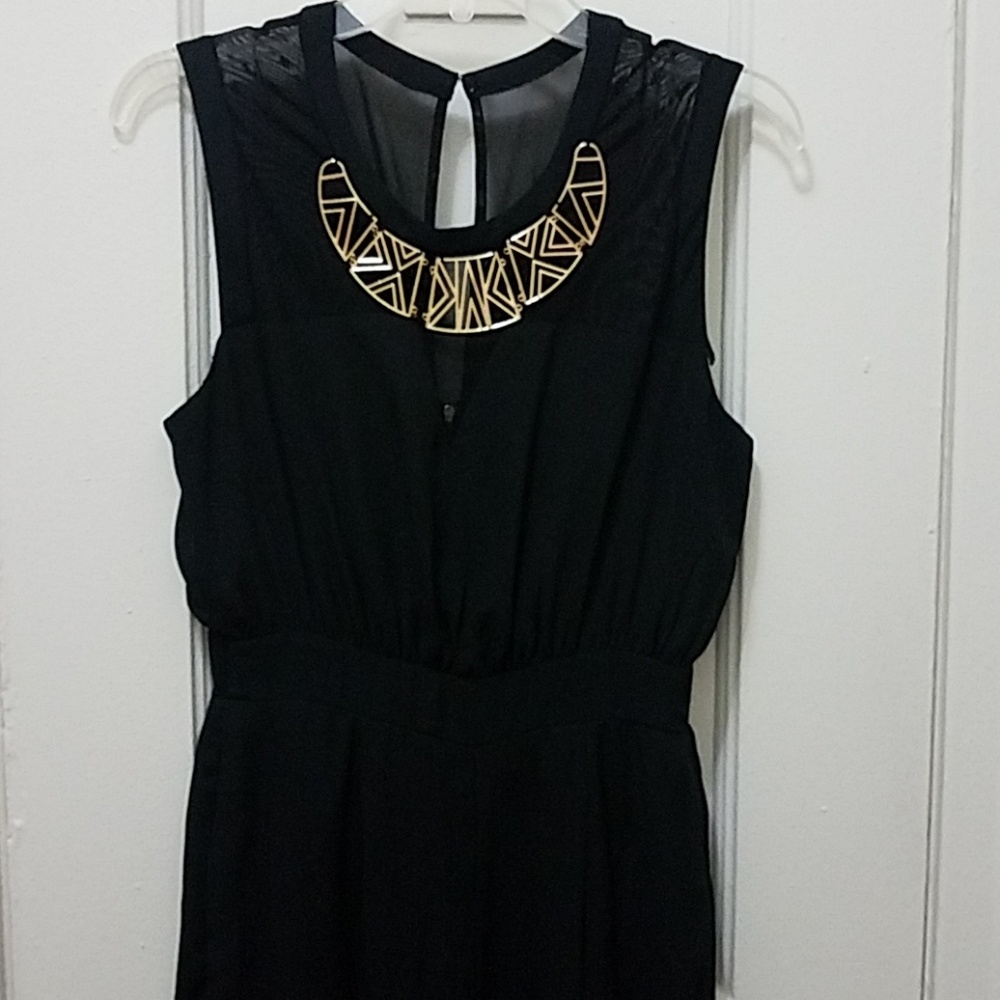 Black Jumpsuit with Gold detail.